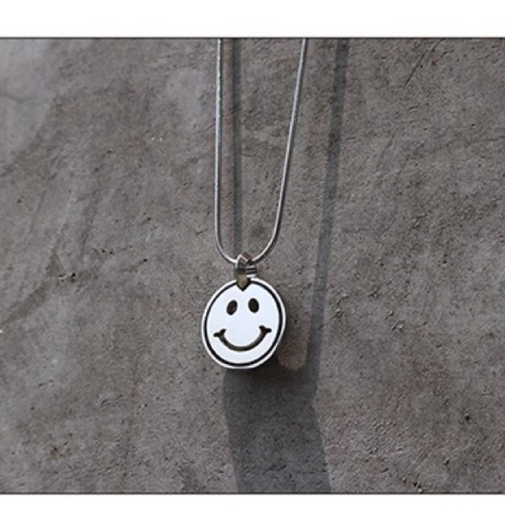 Smiling face necklace.